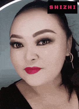a close up of a woman 's face with a shizhi logo in the corner