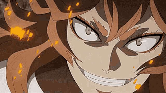 a close up of a cartoon character 's face with fire coming out of it 's eyes .