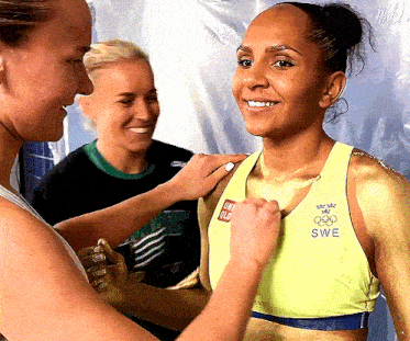 a woman in a yellow top with swe on it