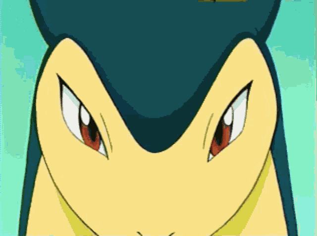 a close up of a cartoon character 's face with horns and red eyes
