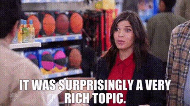 a woman is talking to a man in a store and the words `` it was surprisingly a very rich topic '' are visible .
