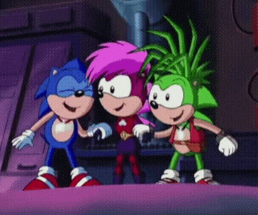 three sonic the hedgehogs are standing next to each other and smiling .