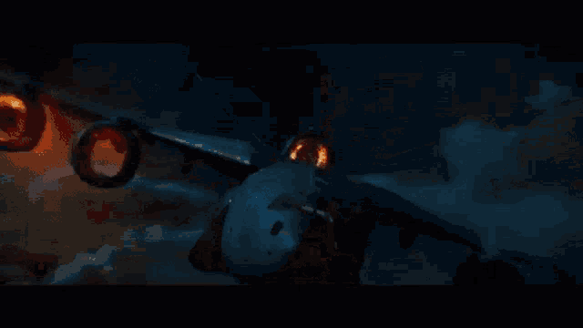 a man in a spiderman costume is flying through the air .