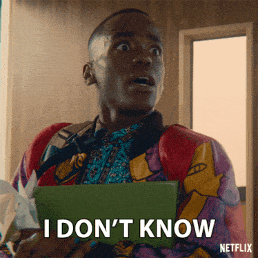 a man in a colorful jacket is holding a tablet and says i don 't know