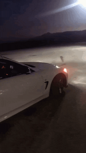 a white car with the number 7 on the side of it