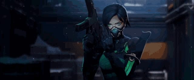 a woman wearing a mask is holding a gun in a dark room .