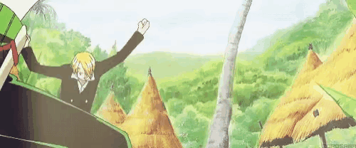 a man is riding a roller coaster with his arms in the air in a forest .