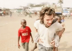 Harry Styles One Direction GIF - Harry Styles One Direction Piggy Back GIFs