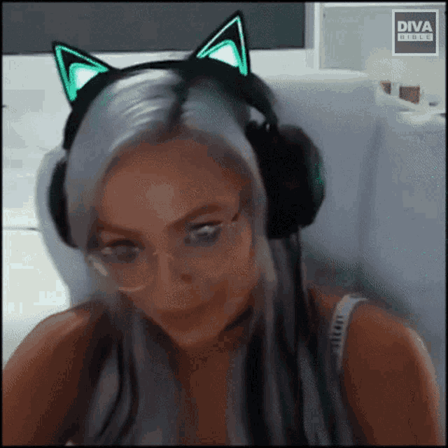 a woman wearing headphones with cat ears and a diva logo in the corner
