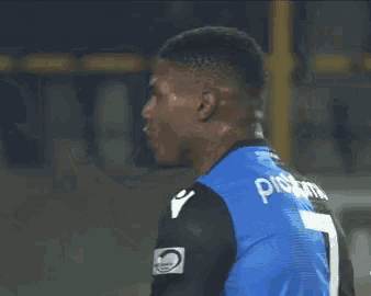a man in a blue jersey with the number 7 on it