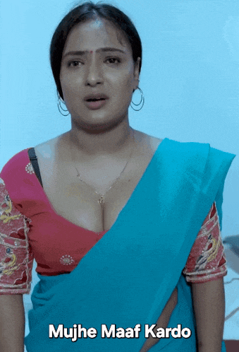 a woman in a blue saree with the words mujhe maaf kardo written below her