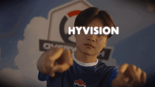 a young man points at the camera with the word hyvision above him