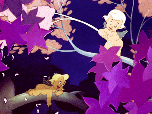 a cupid sitting on a tree branch with purple flowers