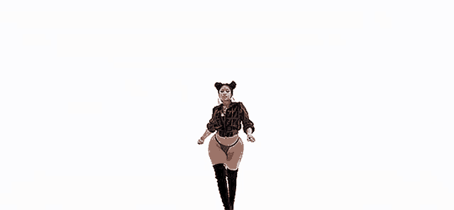 nicki minaj is wearing a fendi jacket and a thong .