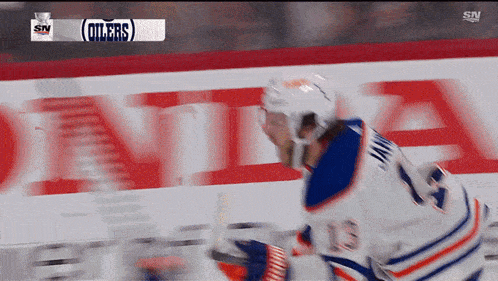 a hockey player with the number 24 on his jersey