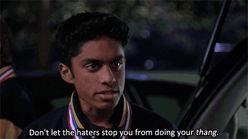 a young man with a medal around his neck says " don 't let the haters stop you from doing your thing "