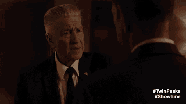 a man in a suit and tie is talking to another man with the words sometimes i really worry about you