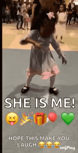 a little girl is dancing on a dance floor with the words `` she is me ! `` hope this make you laugh .