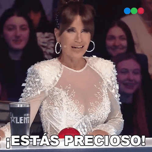 a woman in a white dress with the words estas precioso