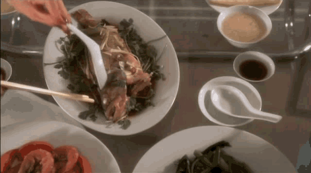 a plate of food on a table with a spoon in it