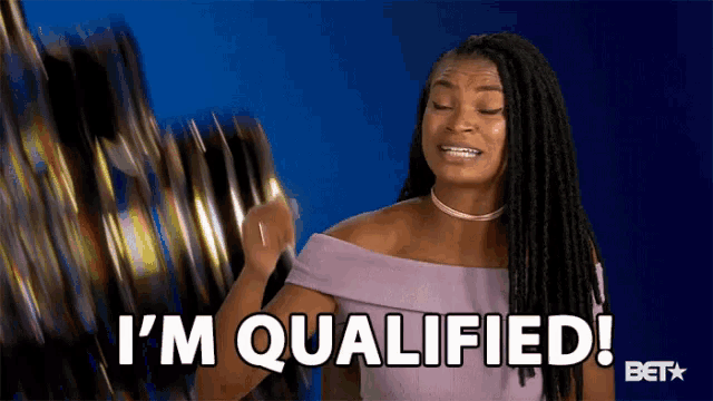 a woman in a purple dress says i 'm qualified .