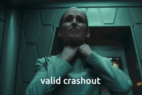 a woman is holding her neck with the words valid crashout written below her