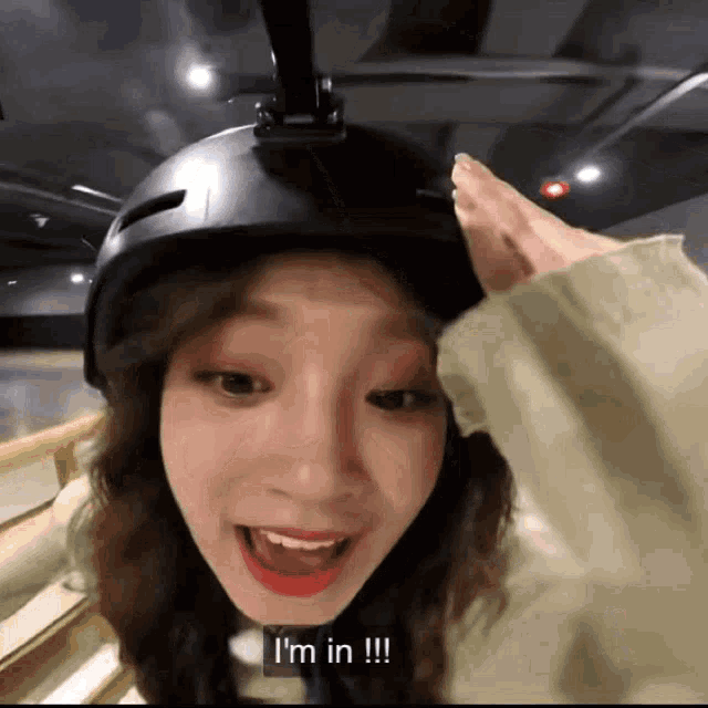 a woman wearing a helmet says " i 'm in "