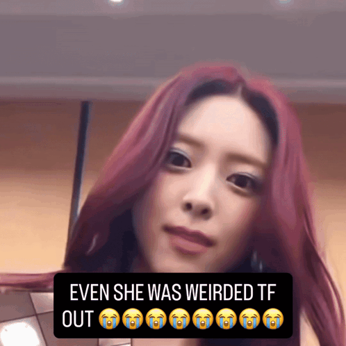 a woman with red hair and a caption that says even she was weirded out