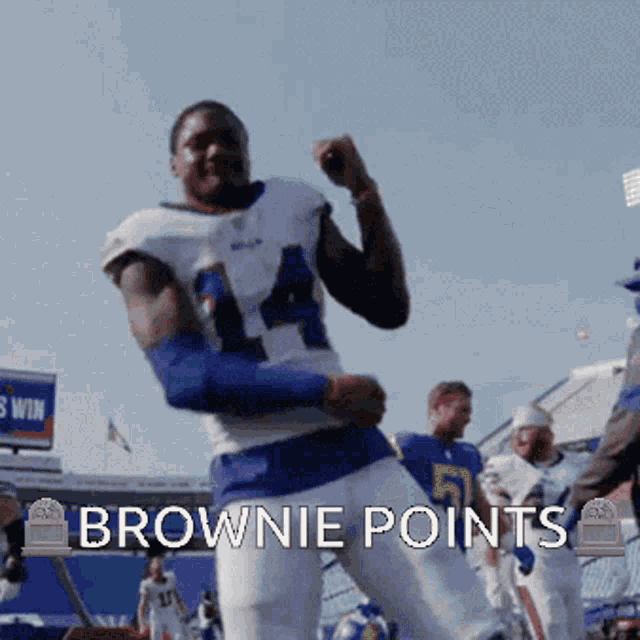 a football player is dancing with the words brownie points behind him