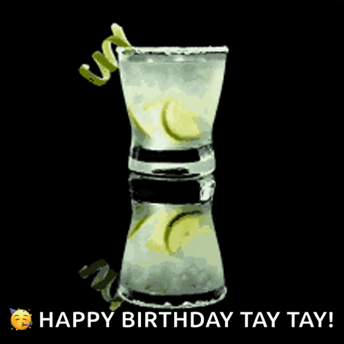a happy birthday greeting card with a shot glass of liquor