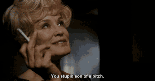 a woman smoking a cigarette with the words you stupid son of a bitch below her