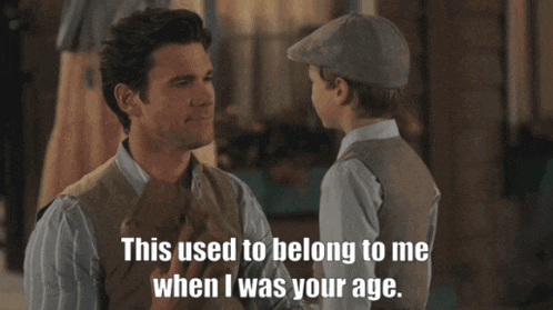 a man talking to a young boy with the words " this used to belong to me when i was your age "