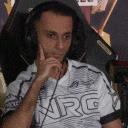 a man wearing headphones and a shirt that says arg on it