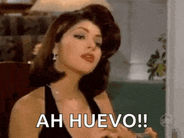 a woman in a black dress is holding a glass and saying ah huevo !