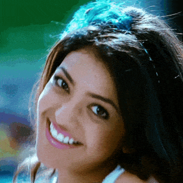 a close up of a woman 's face smiling