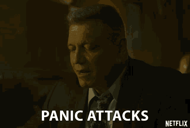 a man in a suit and tie says panic attacks on a netflix screen