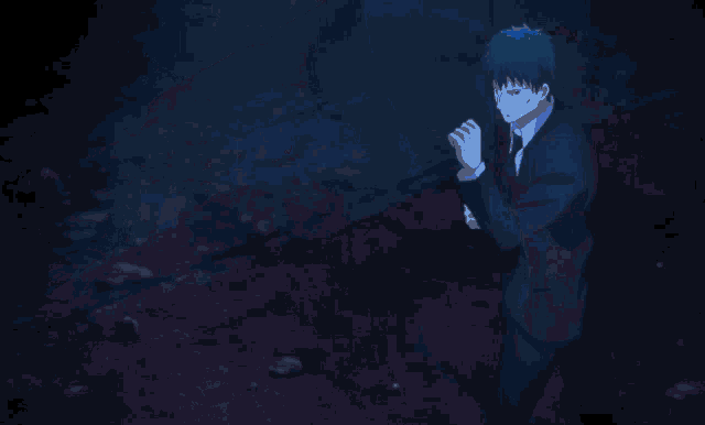 a blue light is shining on a person in a dark room