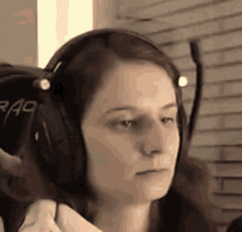 a woman wearing headphones has the word rag written on her back