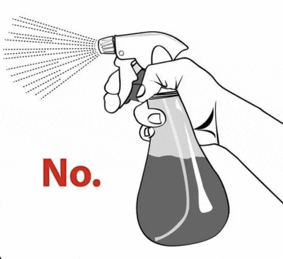 a hand is holding a spray bottle and spraying it with the word no .