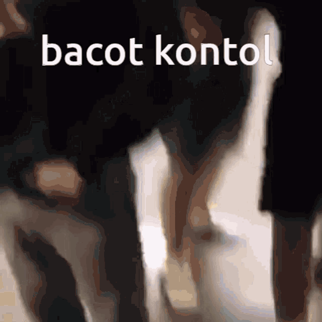 a blurry picture of a person with the words bacot kontol written above them