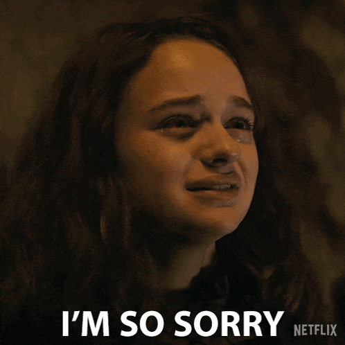 a woman is crying with the words i 'm so sorry behind her
