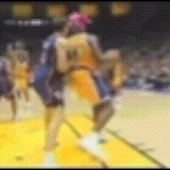 a blurry picture of a basketball game with a player wearing the number 24