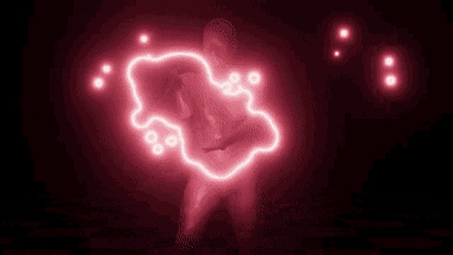 a naked person is surrounded by a red light