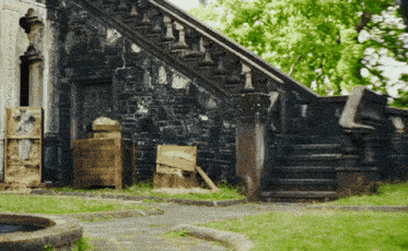 a set of stairs leading up to a stone wall