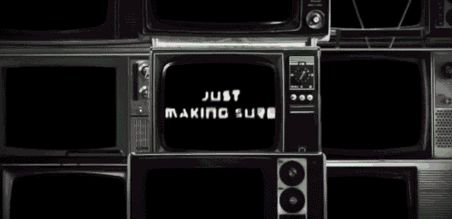 a stack of old televisions with the words just making sure displayed on the screen