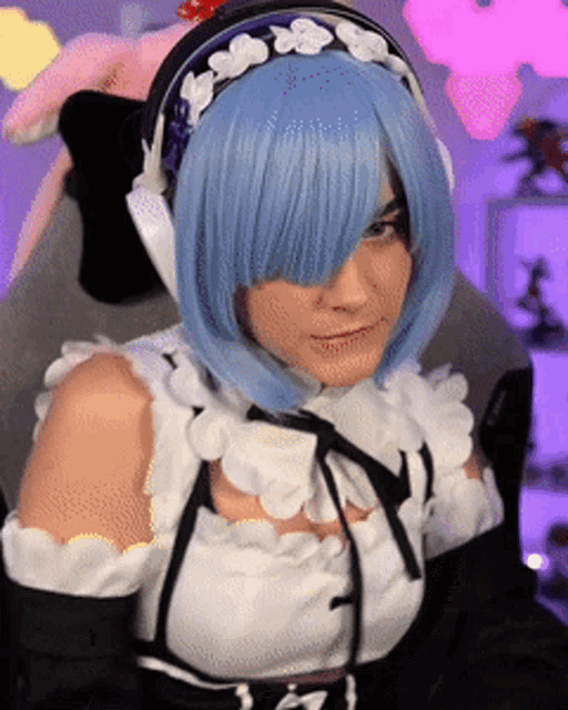a woman in a maid costume is wearing headphones