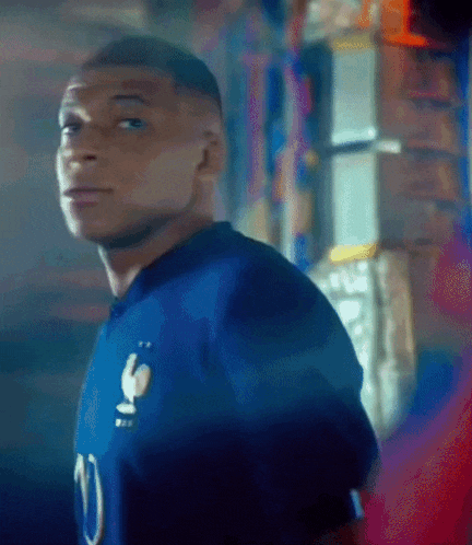 a man in a blue jersey with the number 10 on it