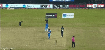a blurred image of a cricket player with the word india on his shirt