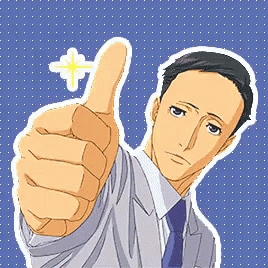 a man in a suit and tie gives a thumbs up sign