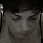 a close up of a woman 's face with a nose ring and the number 39 on her face .